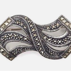 Intricate Silver and Black Brooch